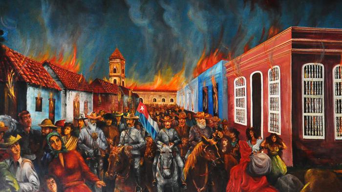 Recreación del incendio de Bayamo, hecho ocurrido el 12 de enero de 1868. La foto es un detalle de un pintura, ubicada en la sede de la Asamblea Municipal del Poder Popular en Bayamo. / Foto: Rafael Martínez Arias.
