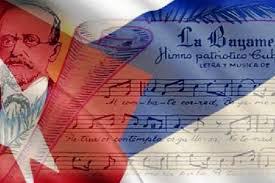 Cartel con las notas de La Bayamesa, la bandera cubana