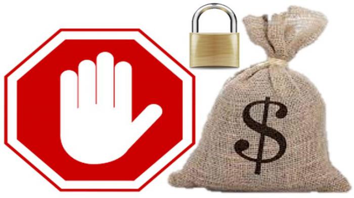 Un símbolo de stop, bolsa de dinero con signo de pesos, y un candado
